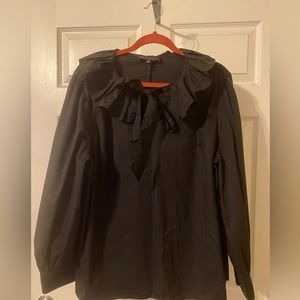 Long sleeved blouse with ruffled neckline and pussy bow tie.